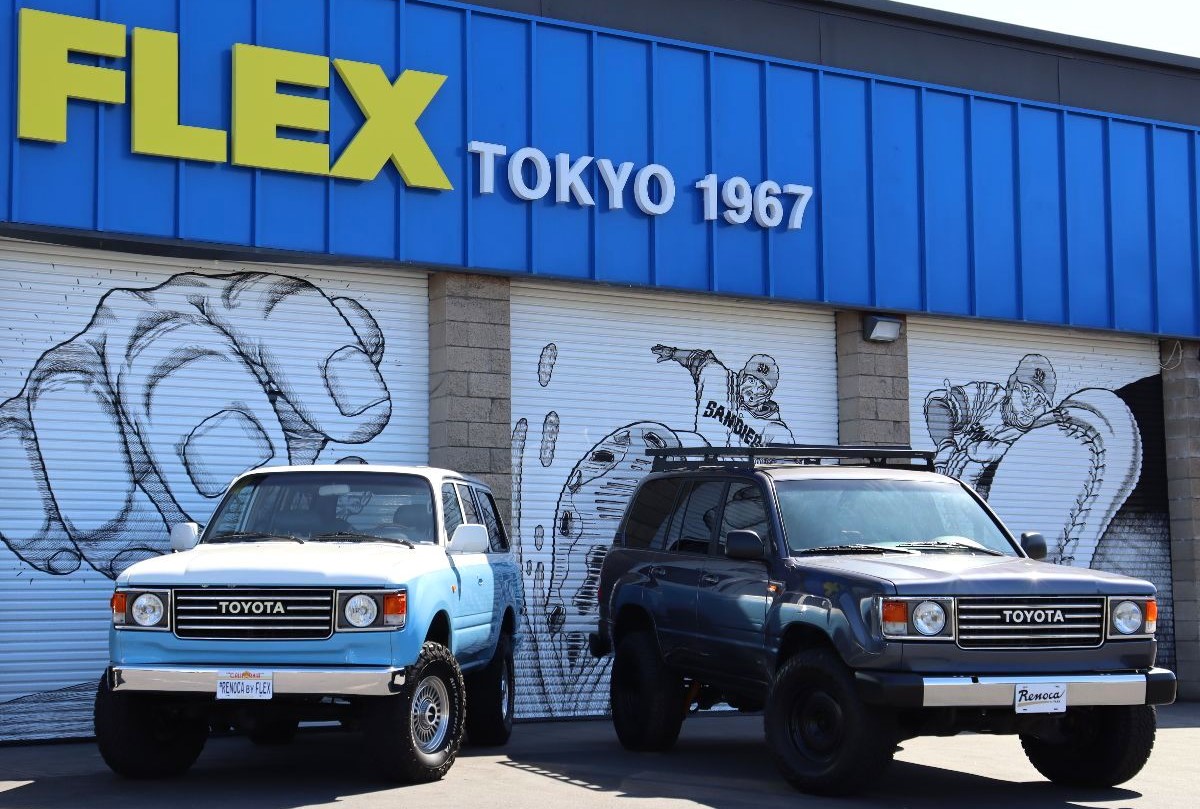 Two Land Cruisers displayed in front of FLEX Automotive