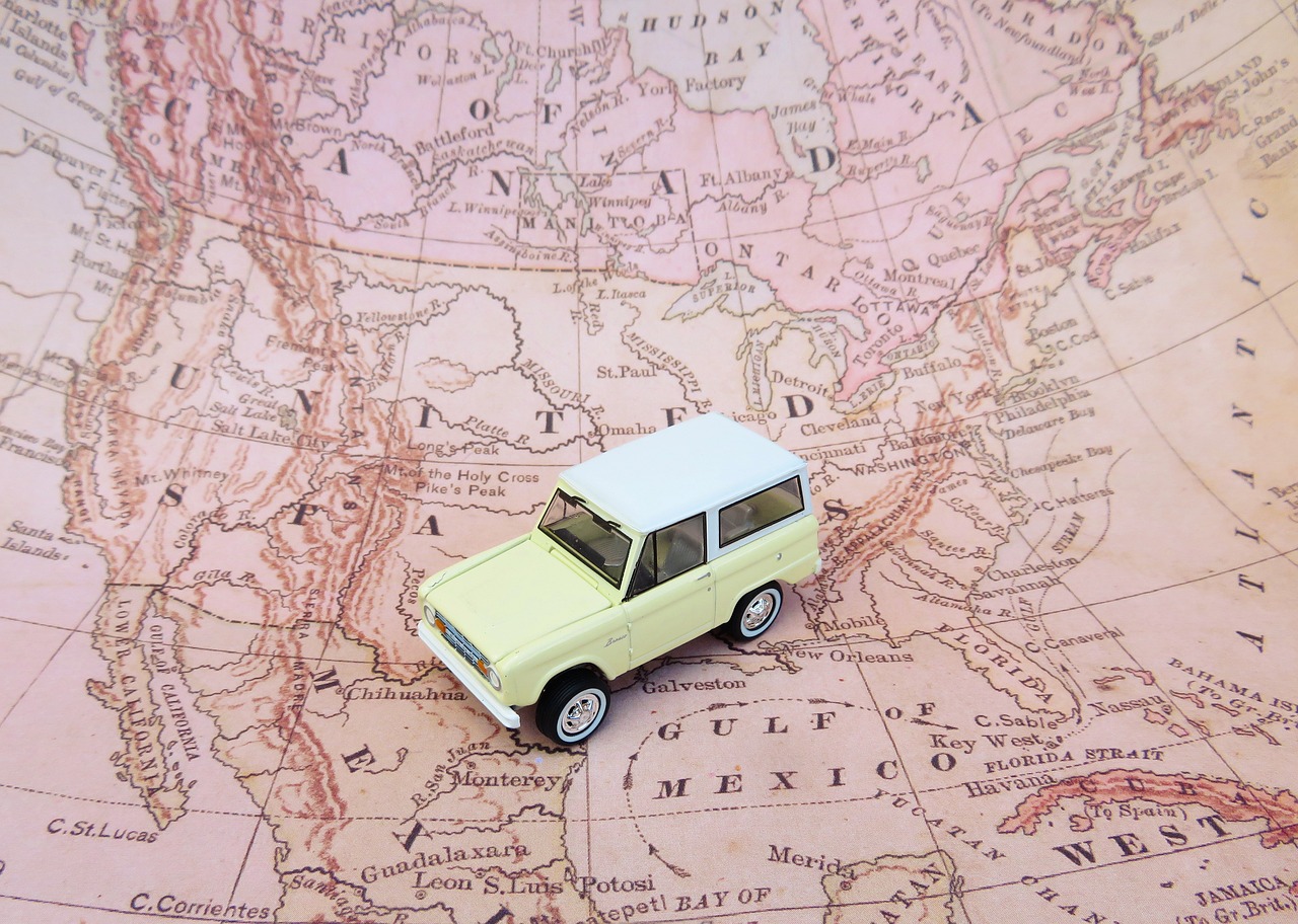 A car toy on a world map