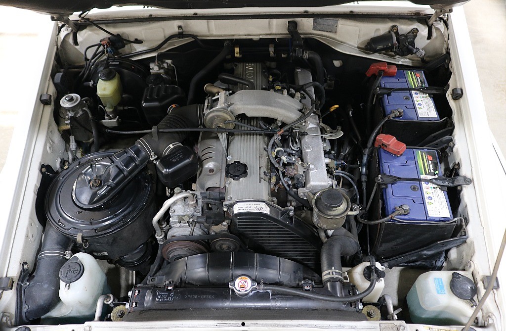 Diesel engine under the hood on 2001 Toyota Land Cruiser 70 at FLEX in Japan