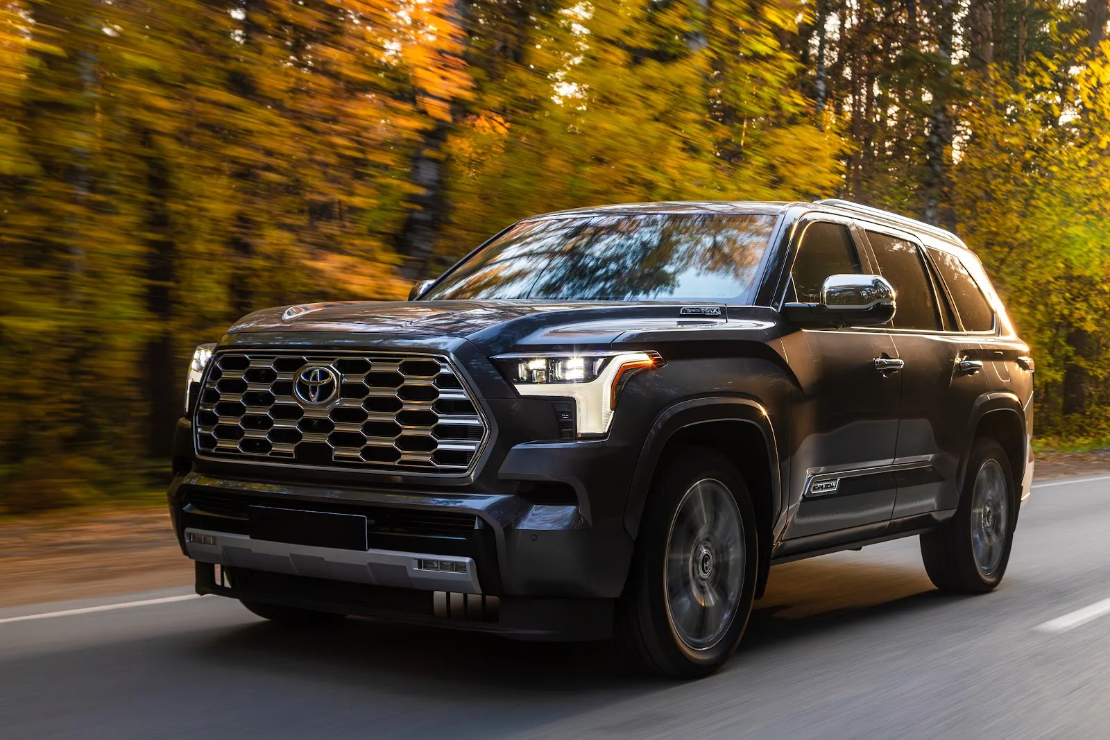 2024 Black Toyota Sequoia Cruising Alongside a Highway