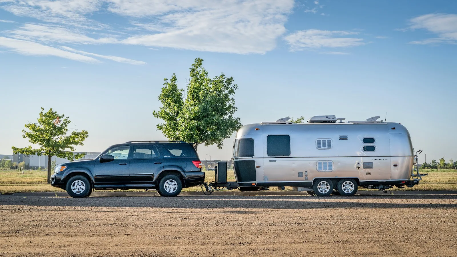 A 1st gen Sequoia coupled with a Camping Trailer