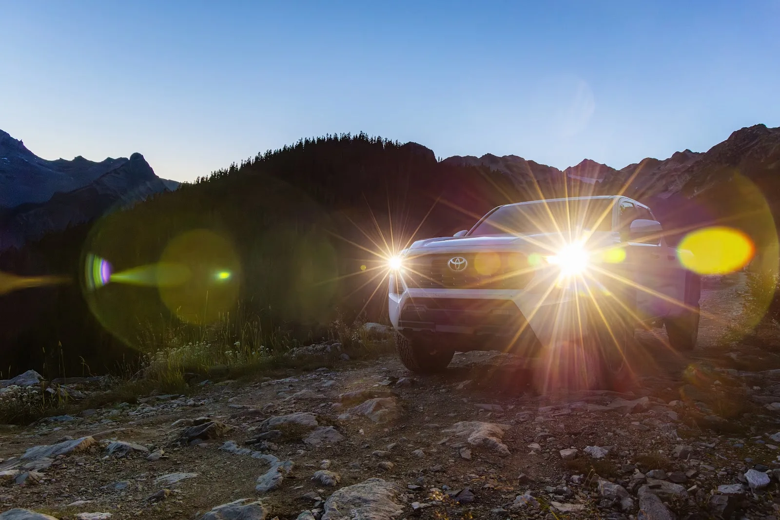 White Toyota Tacoma with all its glory at sunset