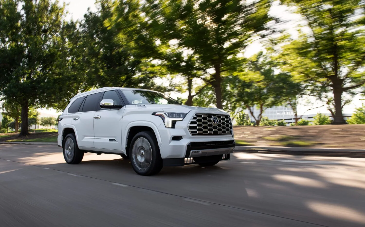2024 Black Toyota Sequoia Cruising Alongside a Highway
