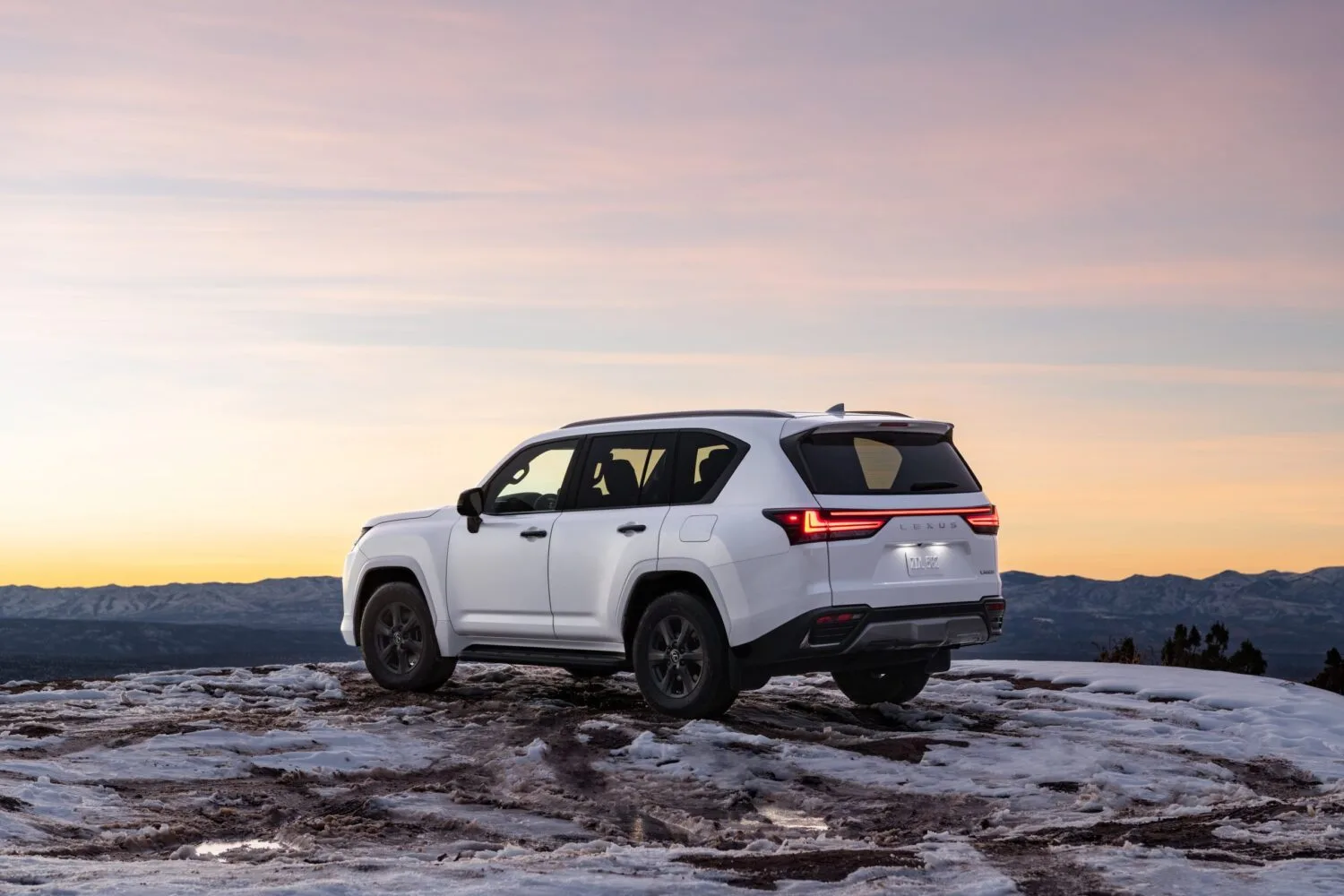 Lexus LX 600 parked on a snowy land - picture from the back
